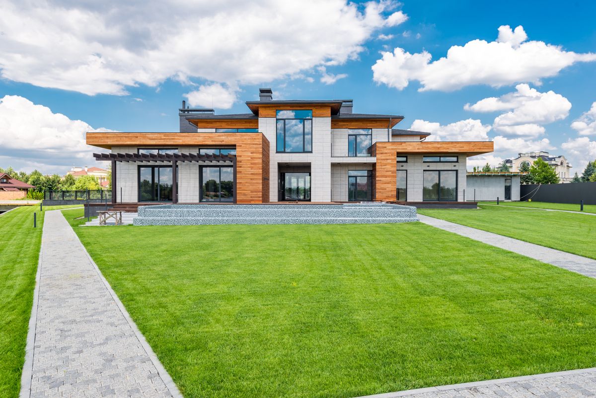 Full-height windows opening a bright home onto a garden